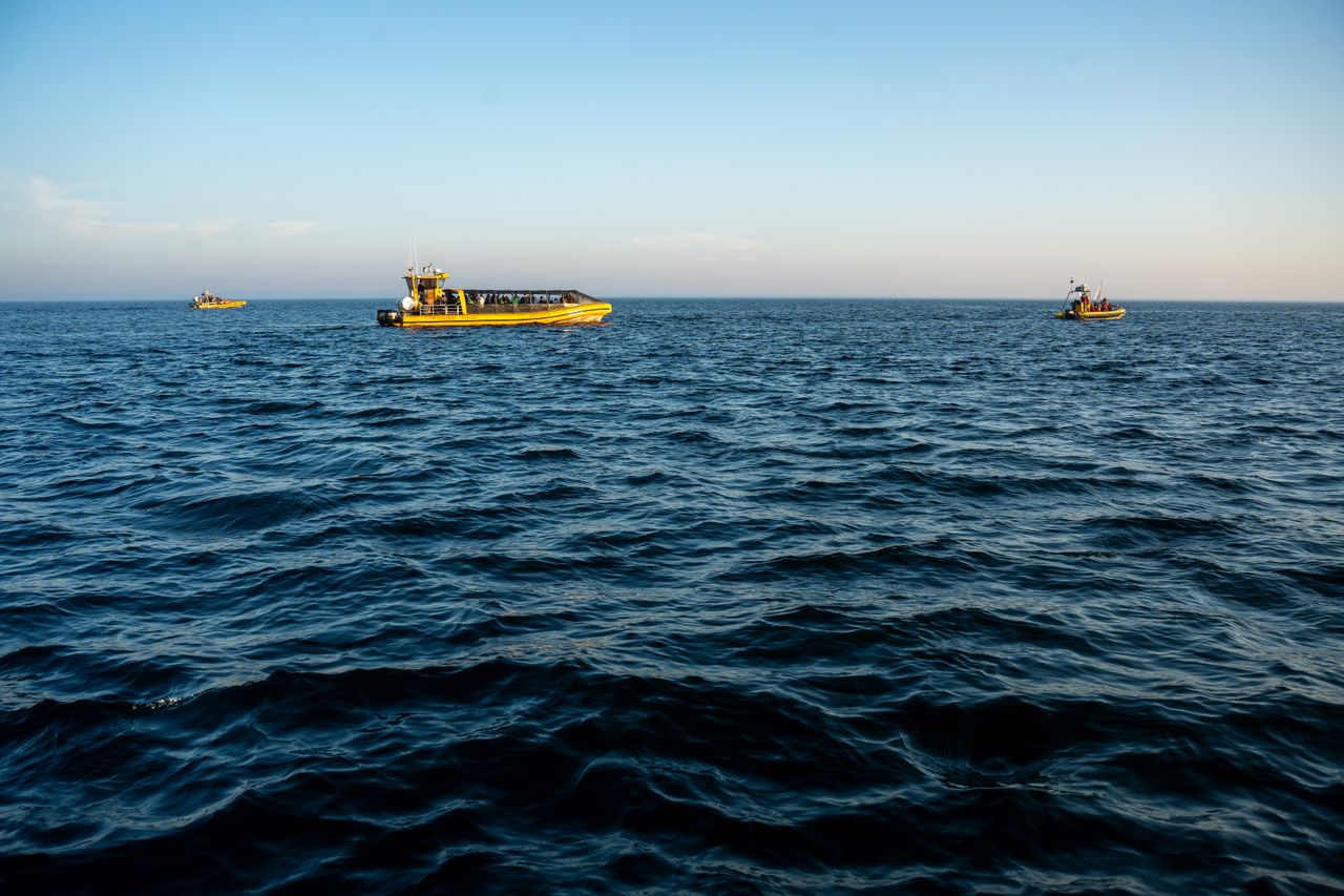 Panoramic view of whale watching boats in the Gulf of St. Lawrence near Tadoussac, Québec.